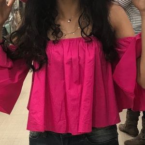 A long sleeve off the shoulder shirt